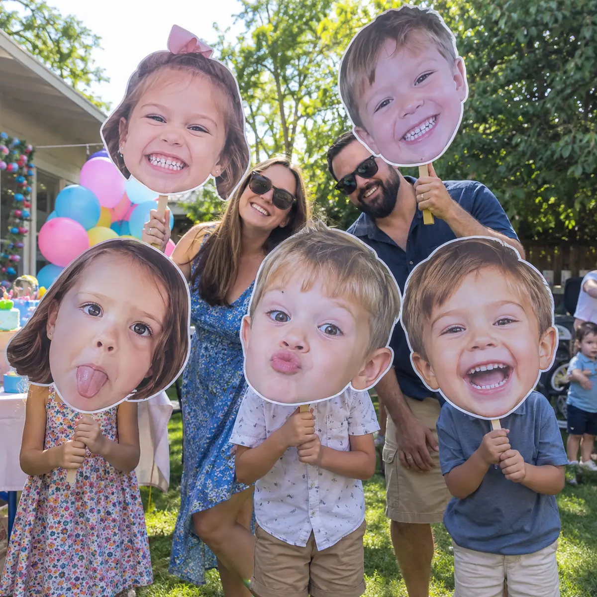 Funny custom big-head photo cutouts at a birthday party
