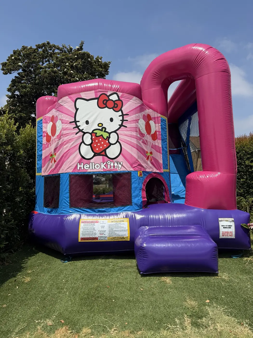 Hello Kitty themed pink and purple bounce house
